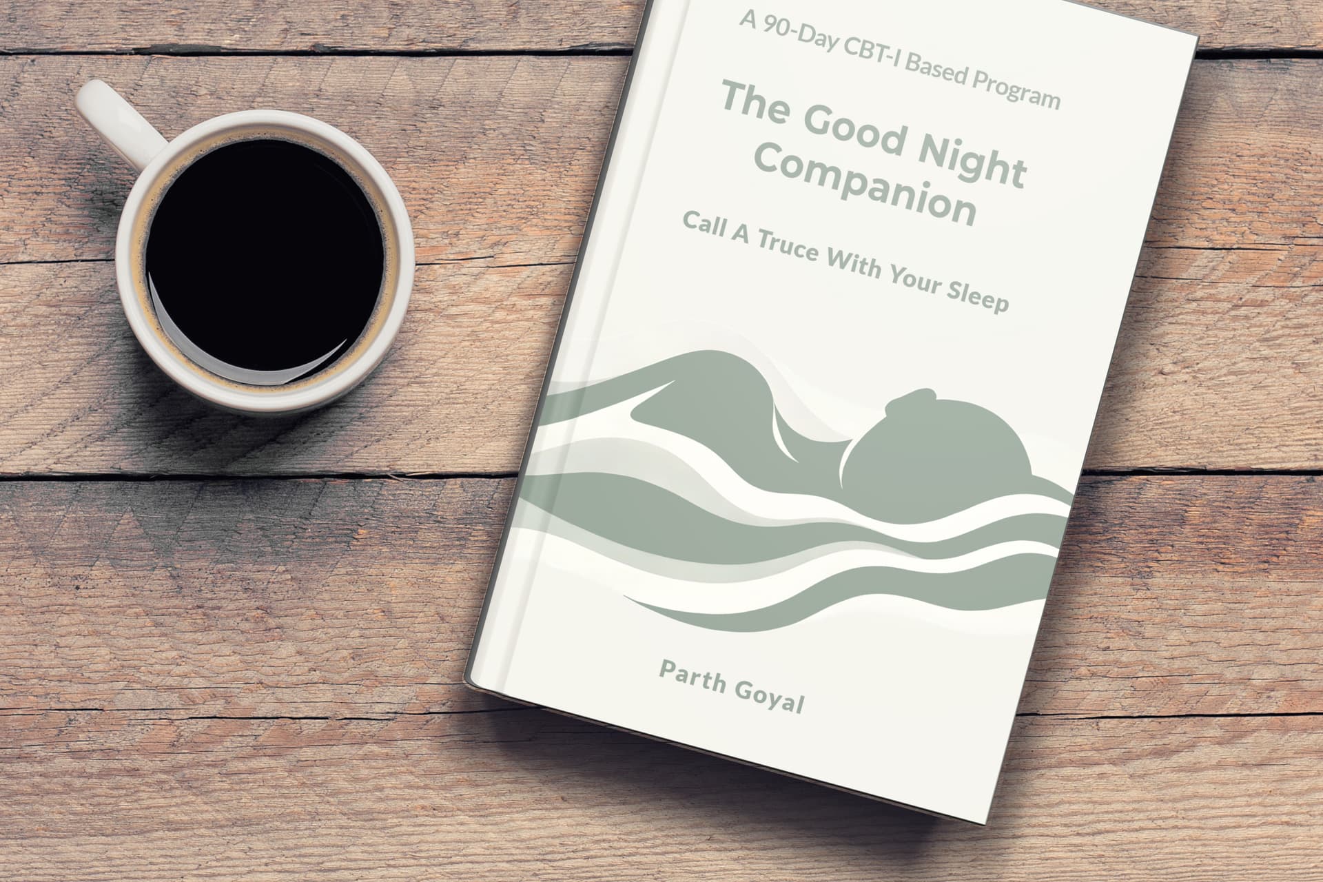 The Good Night Companion — A 90-Day CBT-I Based Program, displayed on a wooden table next to a cup of coffee